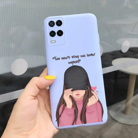 a girl with a hat on her head is holding a phone case