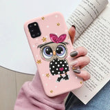 a girl owl with stars and polka dots on her phone case