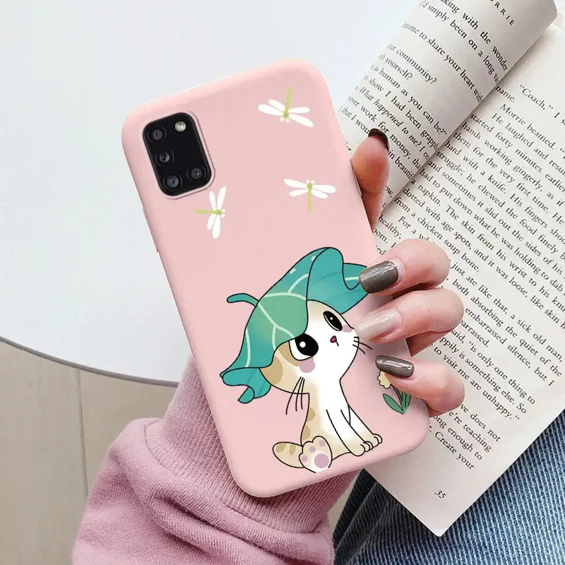 a girl holding a phone case with a cartoon character on it