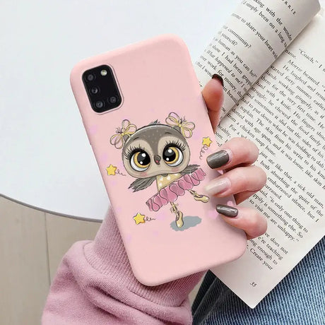 A girl with a pink owl phone case