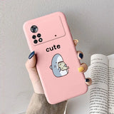 a girl holding a pink phone case with a cute little penguin
