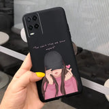 a girl with a hat and a pink coat holding a phone case
