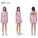 a girl in a purple dress and white sneakers