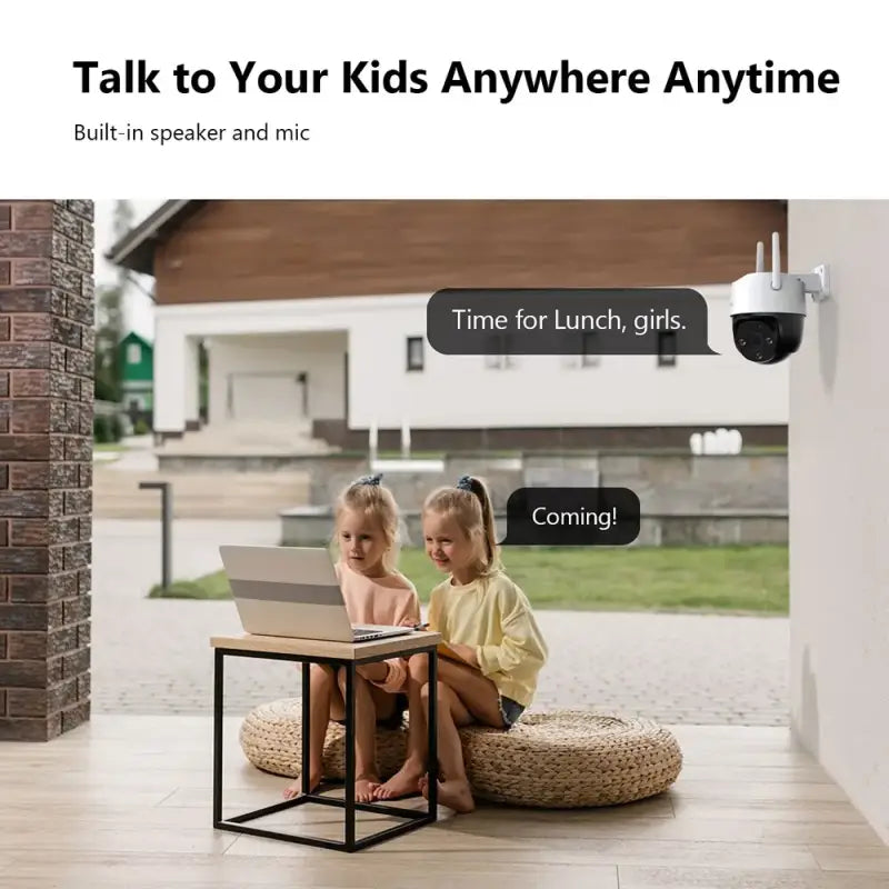 a little girl sitting on a small stool with a laptop