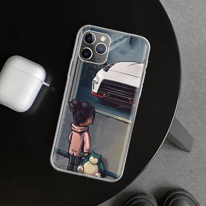 a girl is sitting on a table with a phone case
