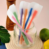 a glass jar filled with colorful plastic straws