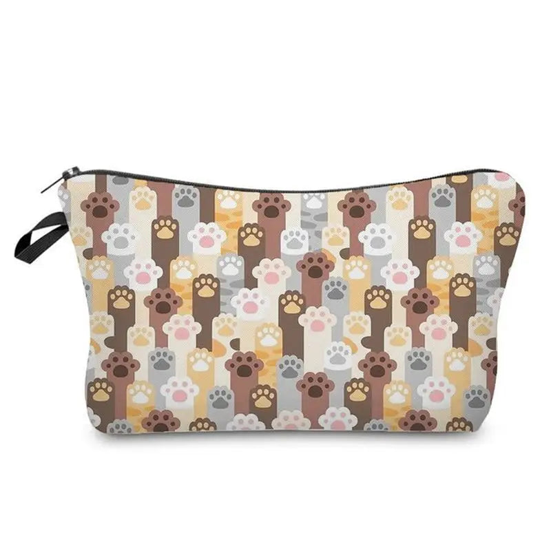 a small cosmetic bag with a pattern of dogs and paws