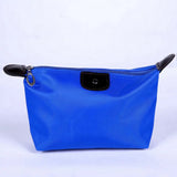 a blue leather pouch with a black leather handle