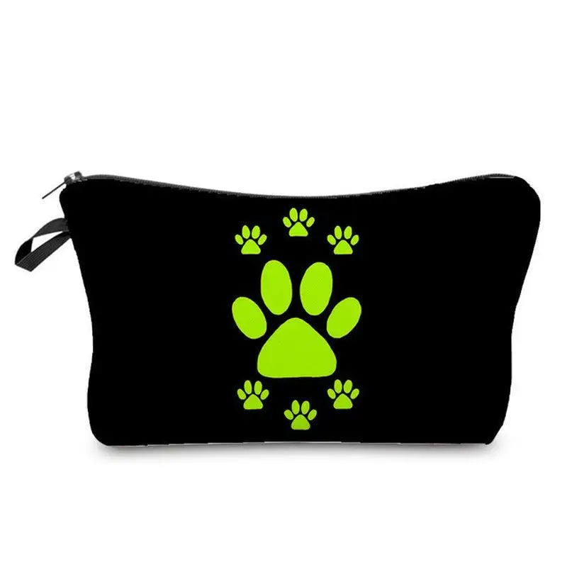 a black and green dog paw print cosmetic bag