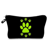 a black and green dog paw print cosmetic bag