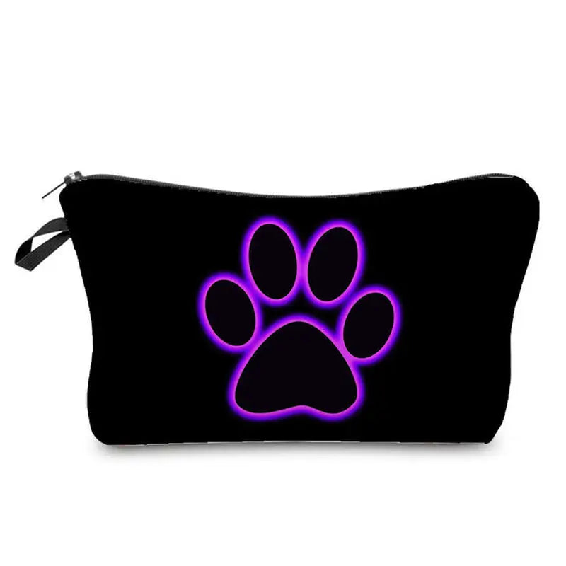 a black cosmetic bag with purple paw print