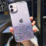 a woman holding up a purple glitter phone case