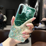 a woman holding a phone case with glitter and stars