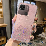 a woman holding a pink glitter phone case