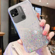 a woman holding a phone case with glitter