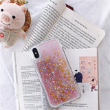 a pink phone case with glitter stars on it