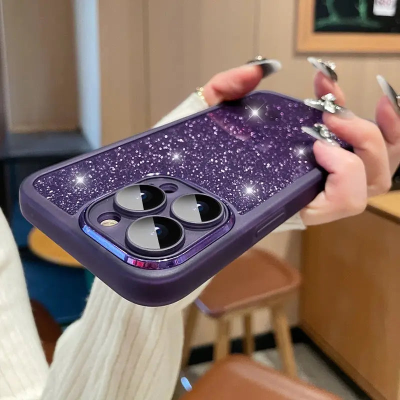 a woman holding a purple phone case with a star design