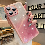 a woman holding a pink iphone case with a diamond ring