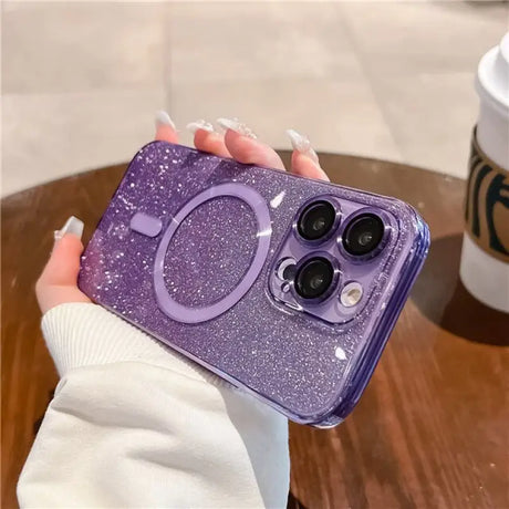 a woman holding a purple glitter phone case