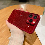 a woman holding a red glitter phone case