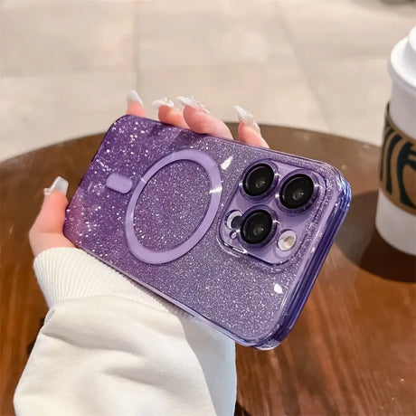 a woman holding a purple glitter phone case