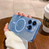 a woman holding a phone case with glitter on it