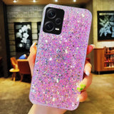 a woman holding a pink glitter phone case