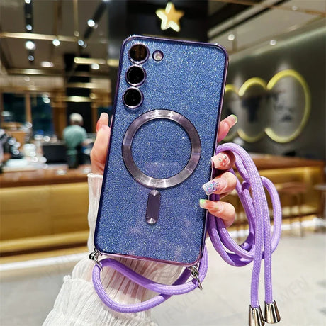 Glittery blue smartphone case with a ring holder and purple lanyard attached.