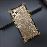 Glittery gold phone case with metallic accents and triple camera cutout.