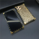 Glittery gold smartphone case with rhinestones and a matching front cover.