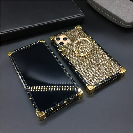 Glittery gold smartphone case with studded edges and a ring holder.