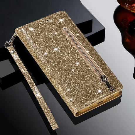 Glittery gold wallet-style phone case with a zipper pocket and wrist strap.