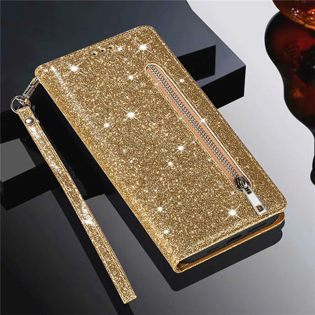 Glittery gold wallet-style phone case with a zipper pocket and wrist strap.