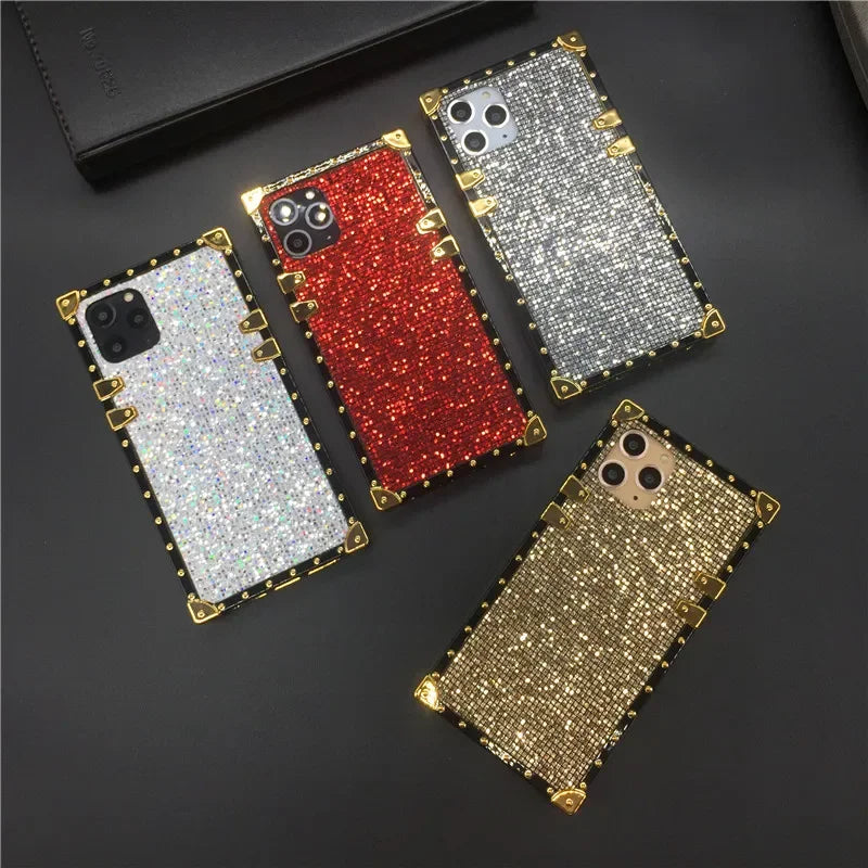 Glittery, jewel-encrusted smartphone cases in various colors.