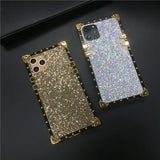 Glittery, jewel-encrusted smartphone cases in gold and iridescent colors.