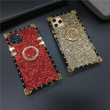 Glittery, jewel-encrusted smartphone cases in red and gold colors.