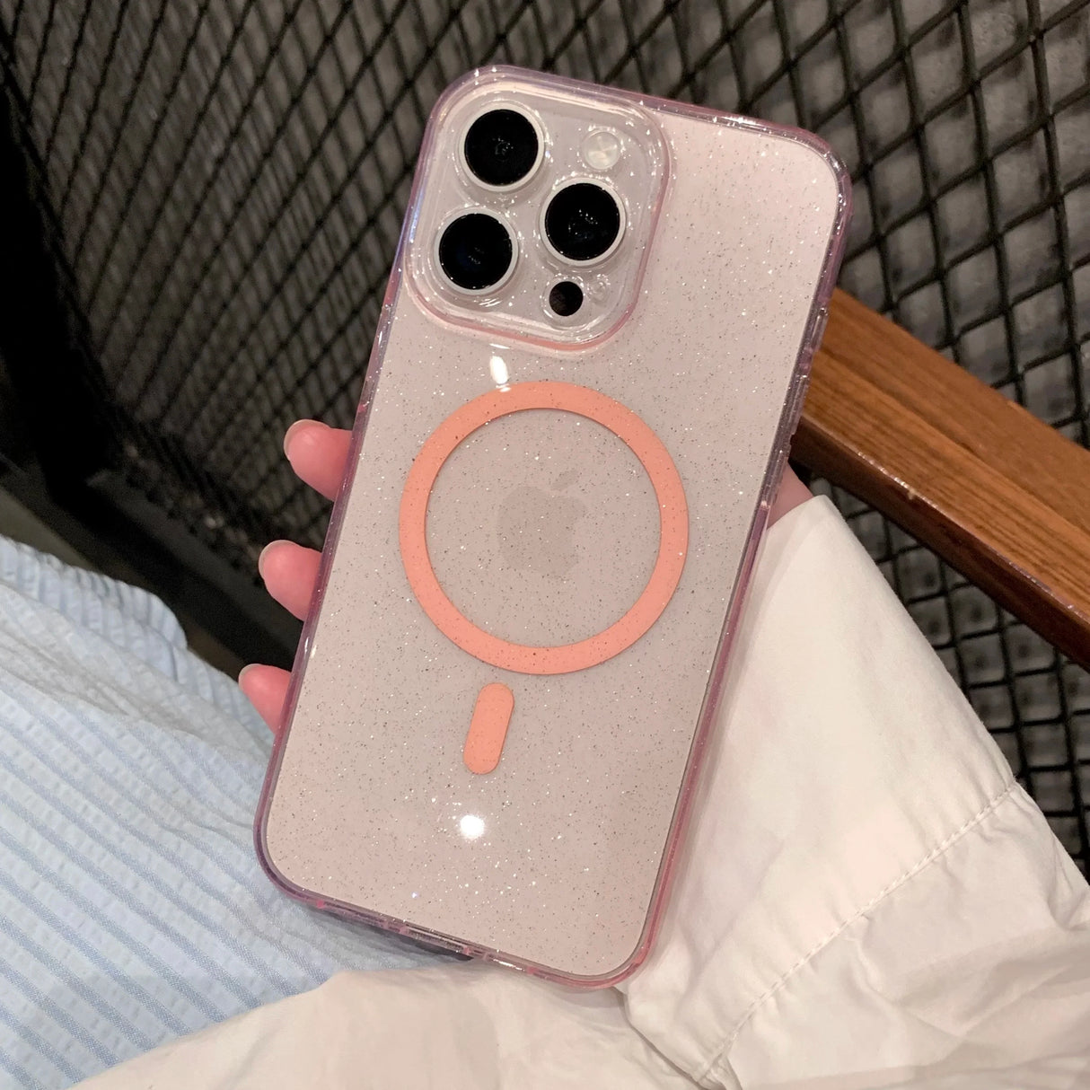 Glittery pink iPhone case with MagSafe ring.
