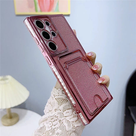 Glittery pink phone case with a camera protector and card slot.