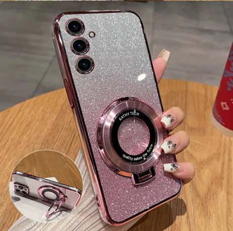 Glittery pink smartphone case with a ring holder and triple camera setup.