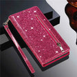 Glittery pink wallet-style phone case with a zipper and wrist strap.