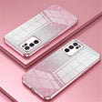 Glittery pink and white smartphone cases with triple camera setups.