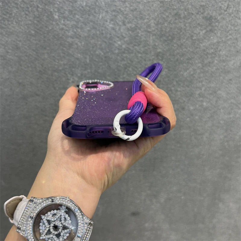 Glittery purple phone case with a purple lanyard and a white, diamond-encrusted watch.