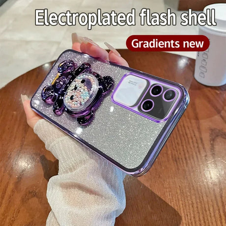 Glittery purple smartphone case with a decorative cartoon character design.