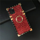 Glittery red and gold phone case with a square camera cutout and ring holder.