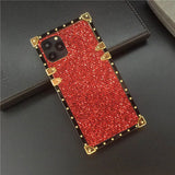 Glittery red smartphone case with gold-colored corner accents and studded edges.