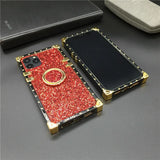 Glittery red smartphone case with gold accents and a ring holder.