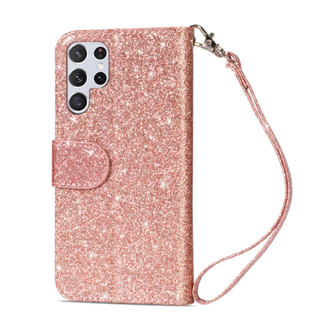 Glittery rose gold smartphone case with a wrist strap and camera cutouts.