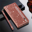 Glittery rose gold wallet-style phone case with a zipper and wrist strap.