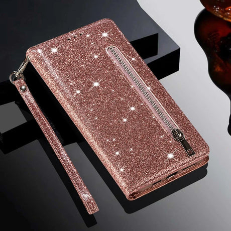 Glittery rose gold wallet-style phone case with a zippered pocket and wrist strap.