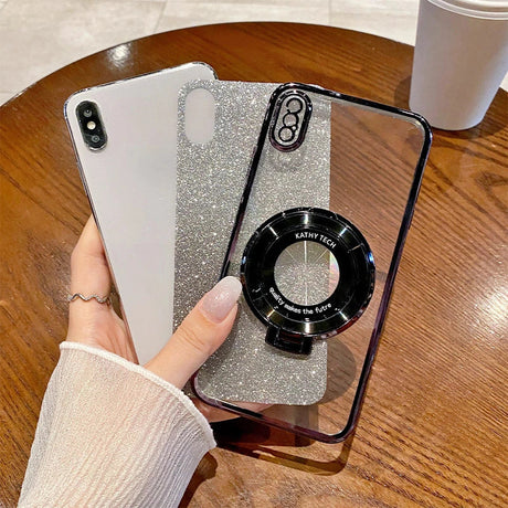 Glittery silver phone case with a circular black attachment on the back.